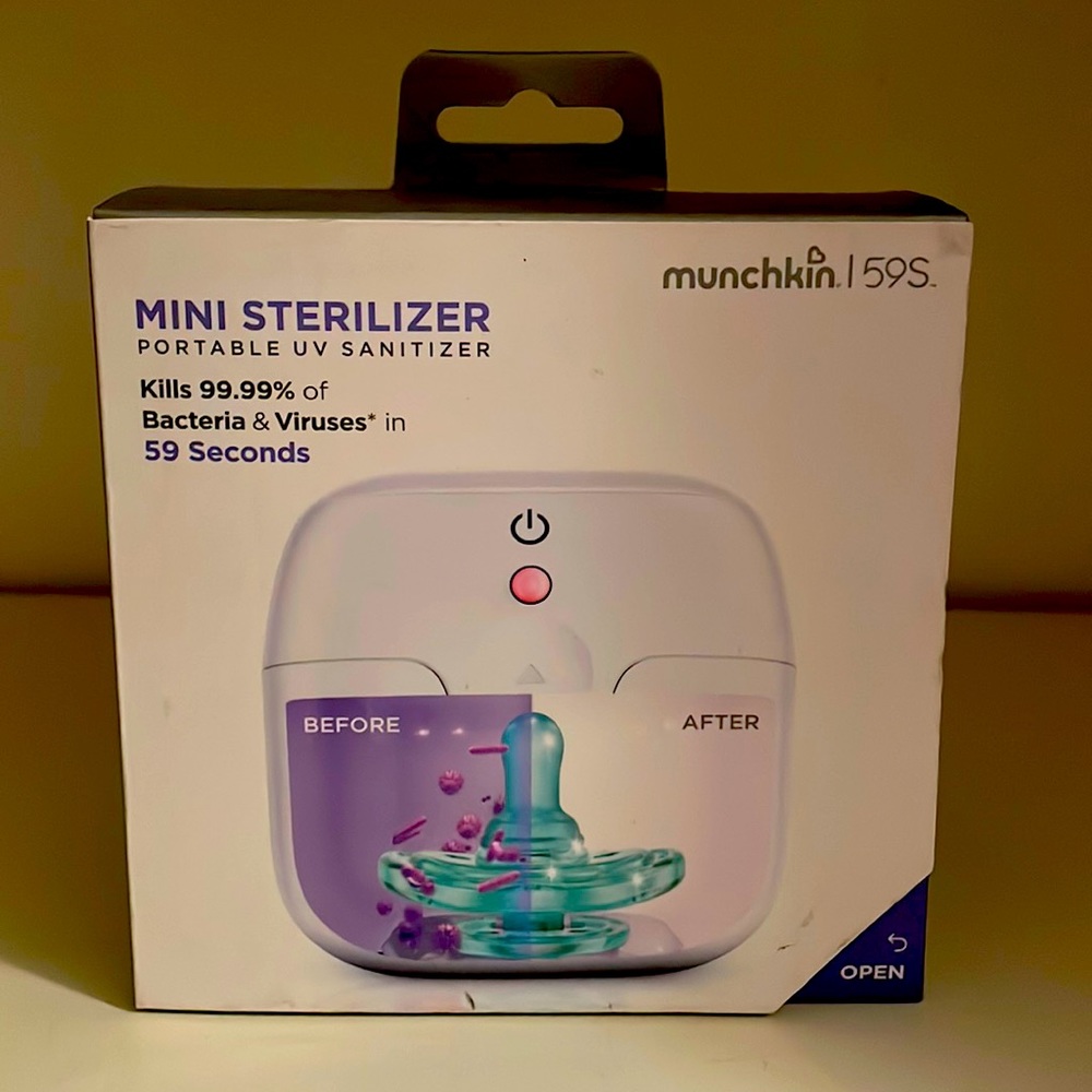 One new in box Munchkin Mini Sterilizer , very cute and handy to travel with